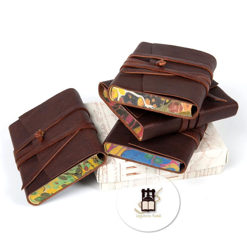 Amazing old-style leather wrap journals with hand colored paper boards