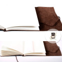 Brown leather photo album with ivory sheets